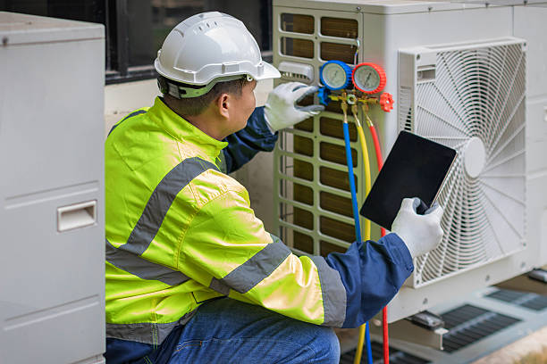 Professional Heat Pump Repair technician working in Hampstead, NH